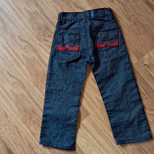 Black Jeans with Red Accents and Classic Style